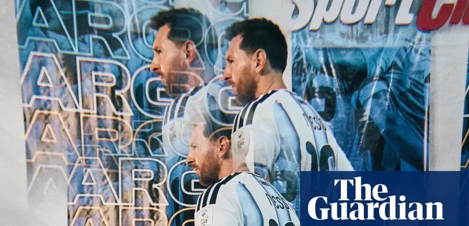 Lionel Messi standing in front of promotional backdrop