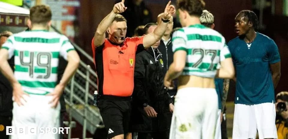 Referee addressing players during a match stoppage