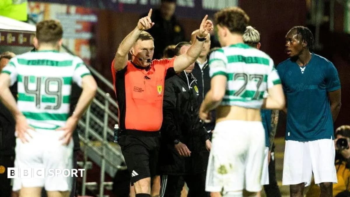 Referee addressing players during a match stoppage