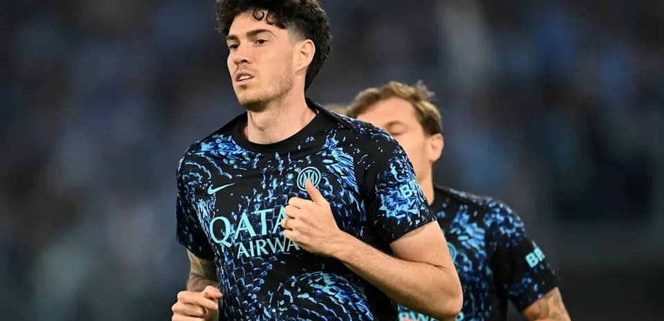 Player running in blue training kit during warm-up