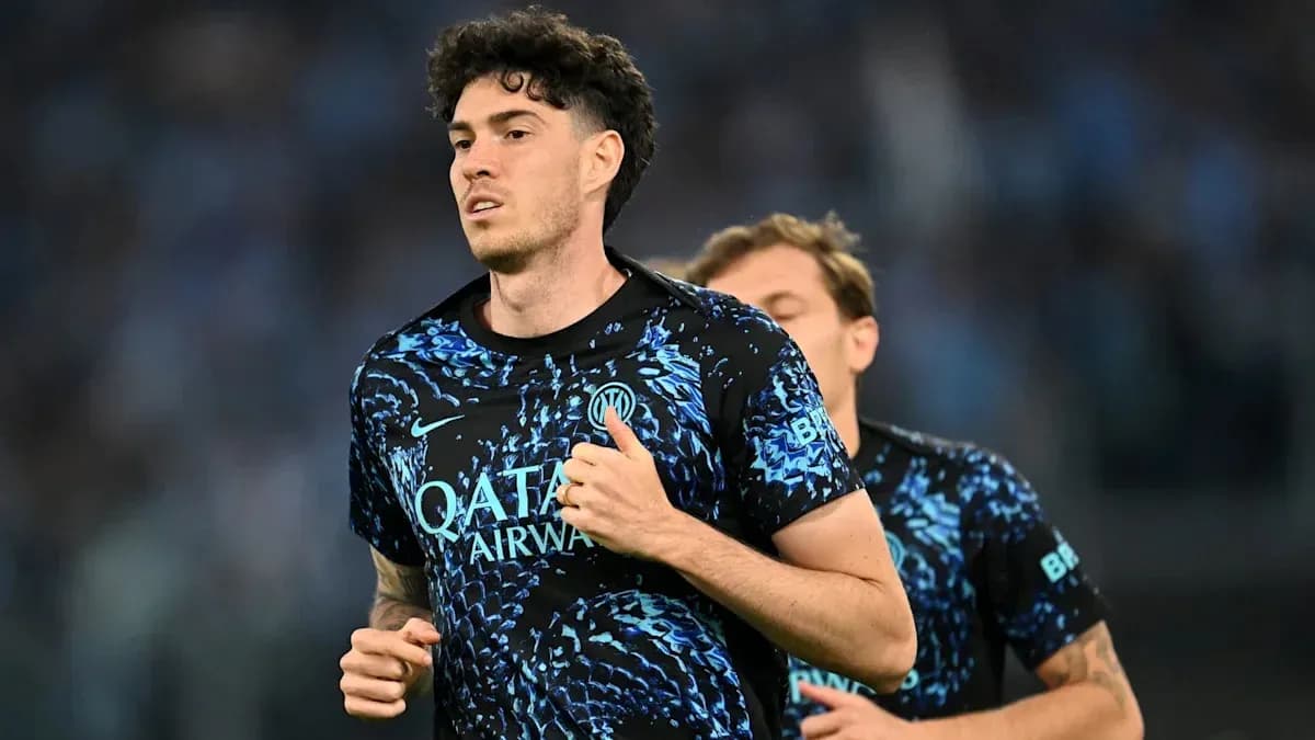 Player running in blue training kit during warm-up