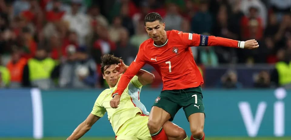 Cristiano Ronaldo evading a tackle during match