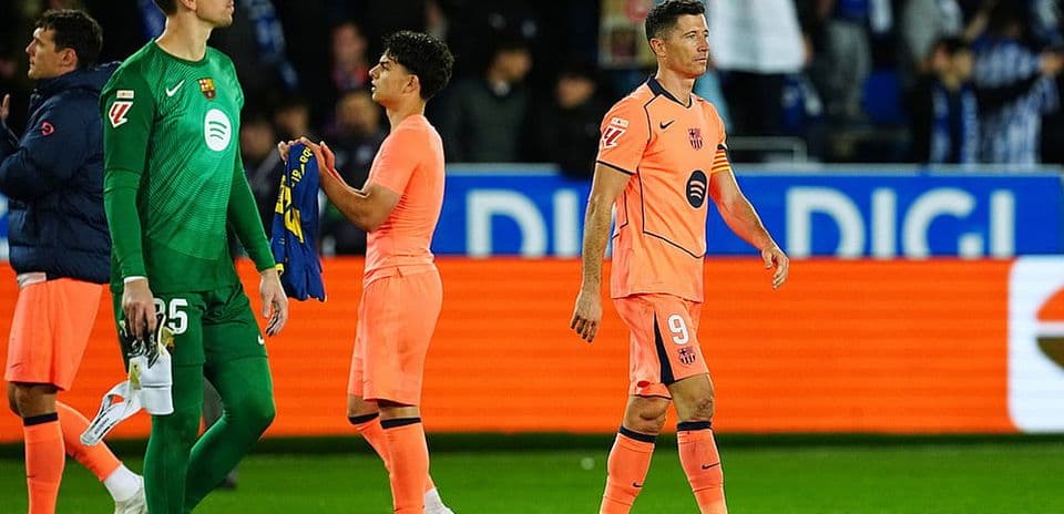 Barcelona players leaving the pitch after match