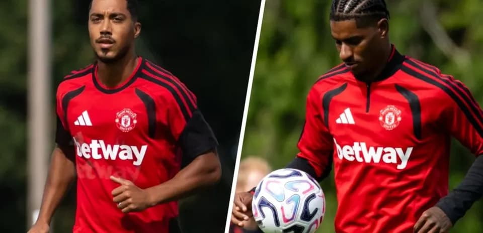 Two Manchester United players training in red kits