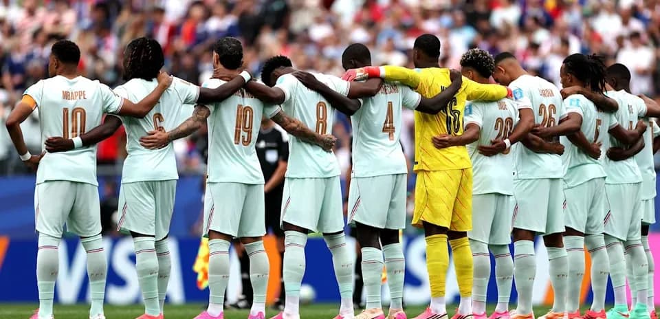 Players standing in a line with arms around each other
