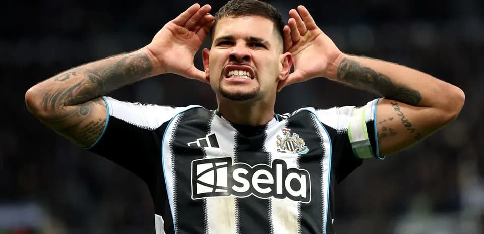 Player celebrating with hands on ears at stadium
