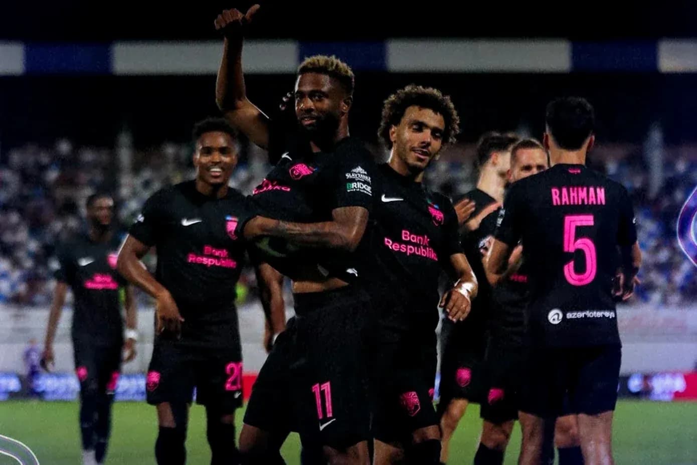 Players celebrating a goal during UEFA match