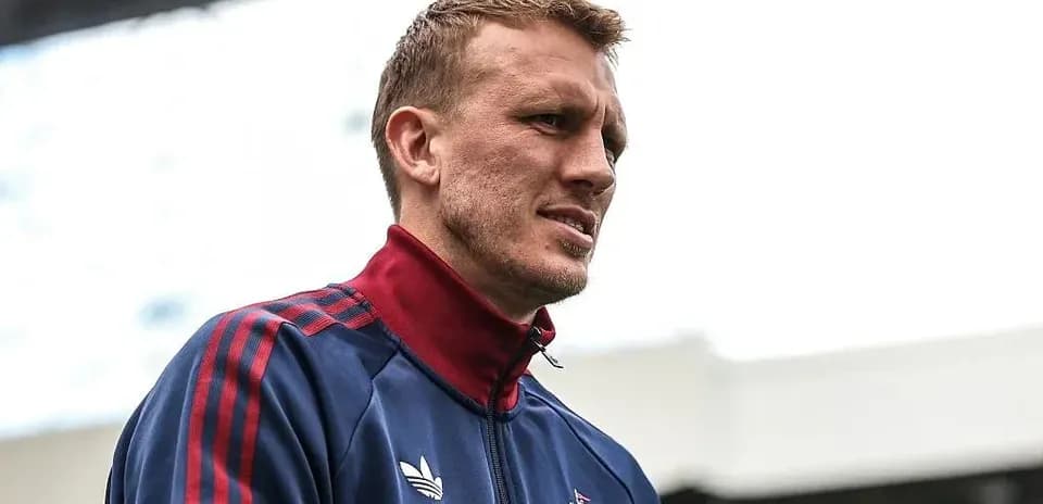 Player in training gear on stadium pitch