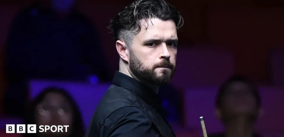 Snooker player preparing for a shot during match