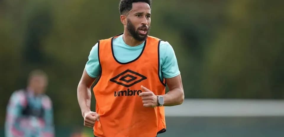 Player training in orange bib during practice session