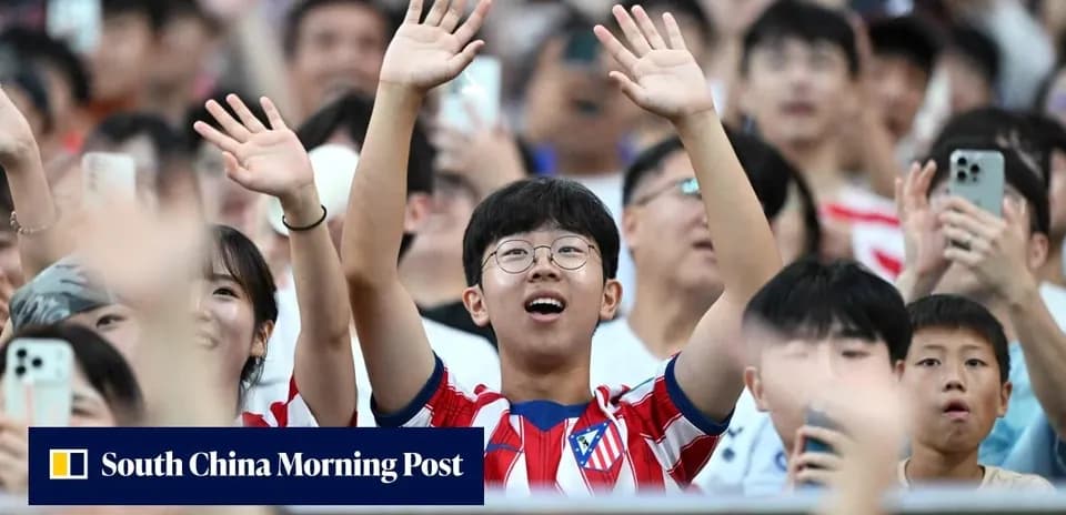 Fans cheering enthusiastically in a crowded stadium