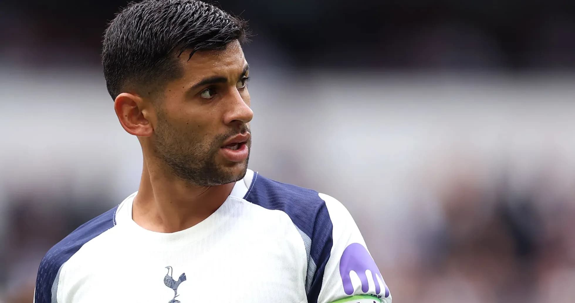 Player wearing Tottenham kit during match action