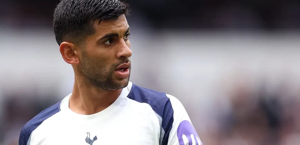 Player wearing Tottenham kit during match action
