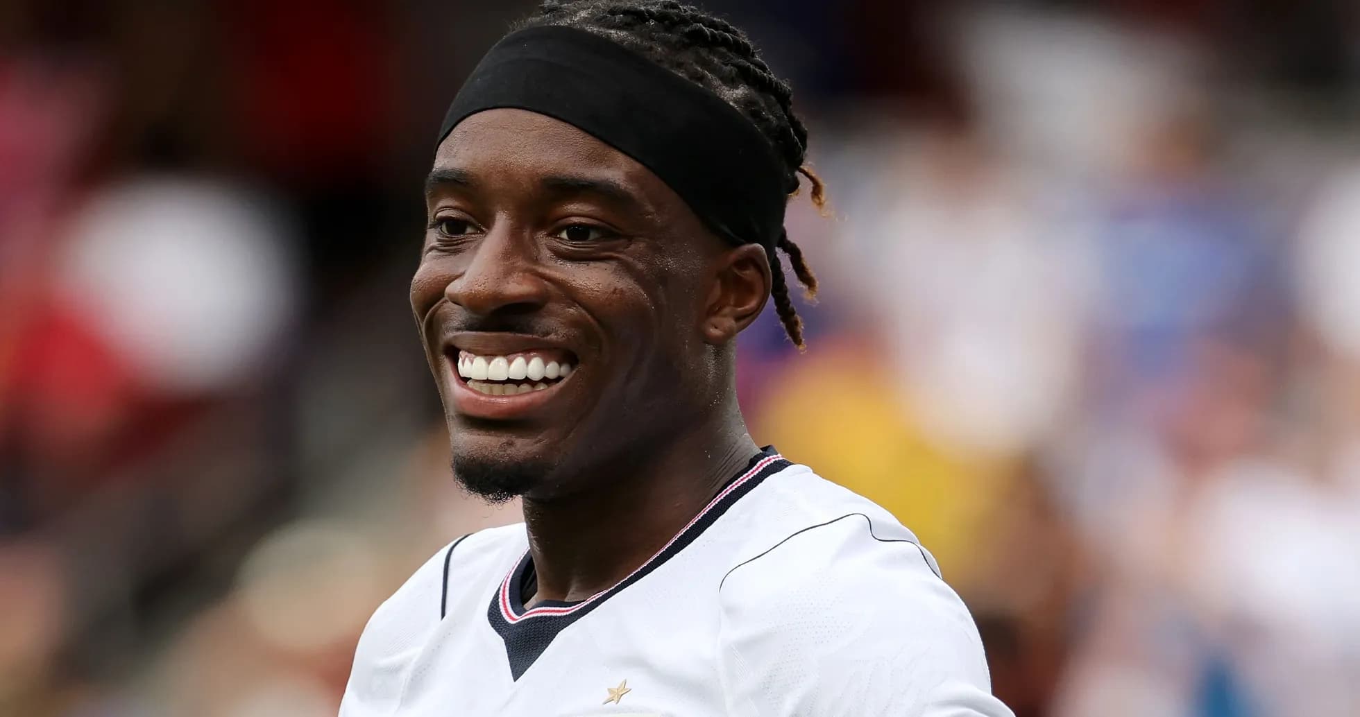 Player smiling during a soccer match