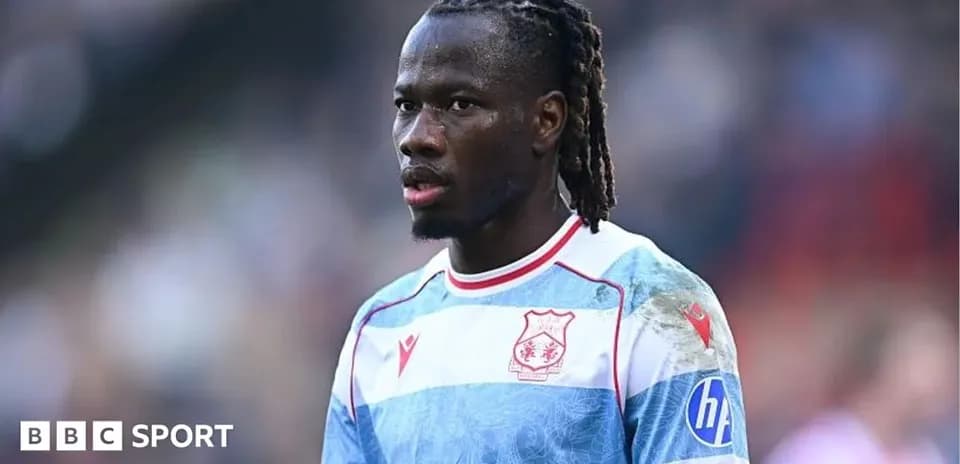 Player in team jersey during a match