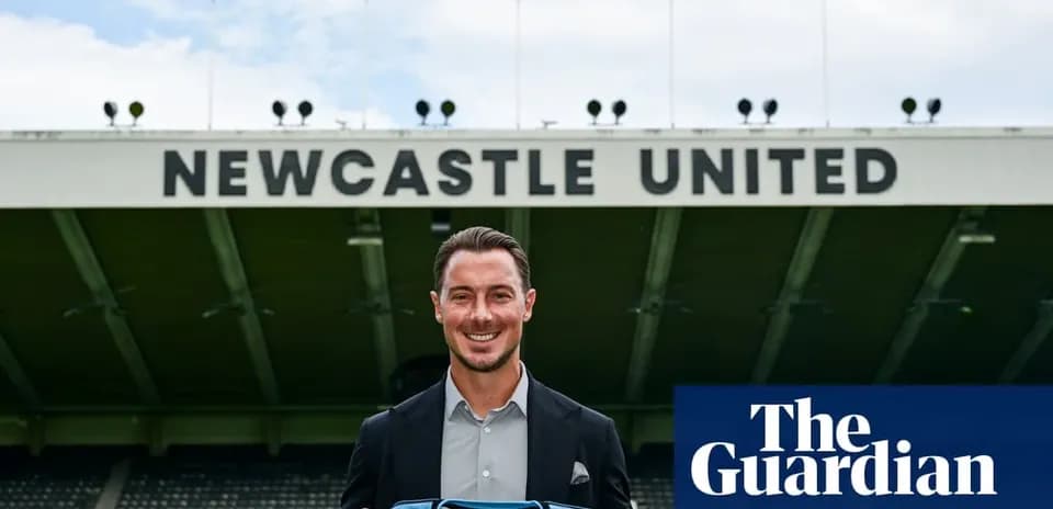 Newcastle United player holding team jersey outside stadium
