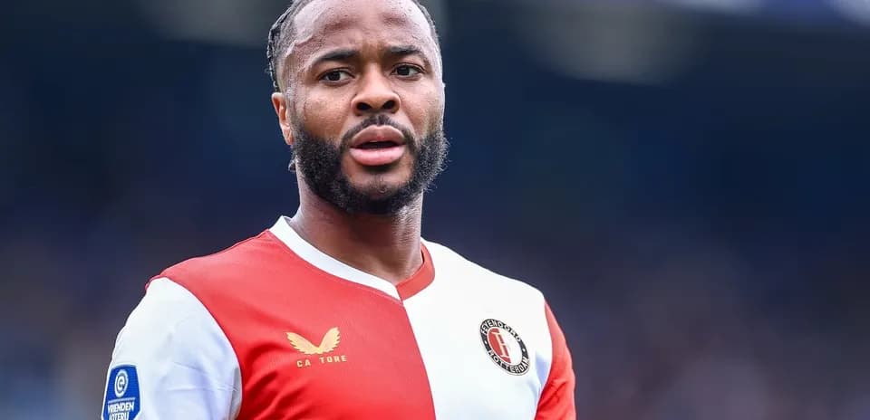 Feyenoord player in red and white kit on field