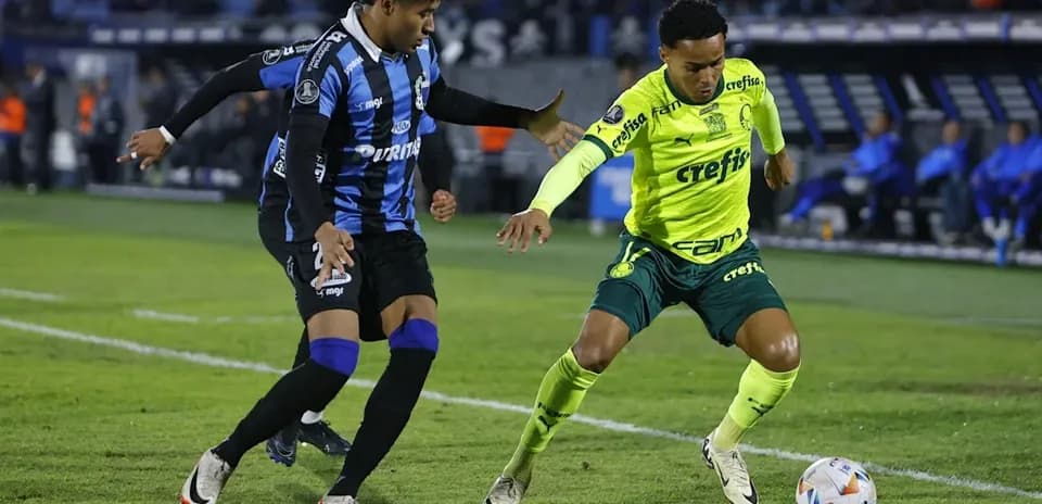 Two players contesting for the ball on field