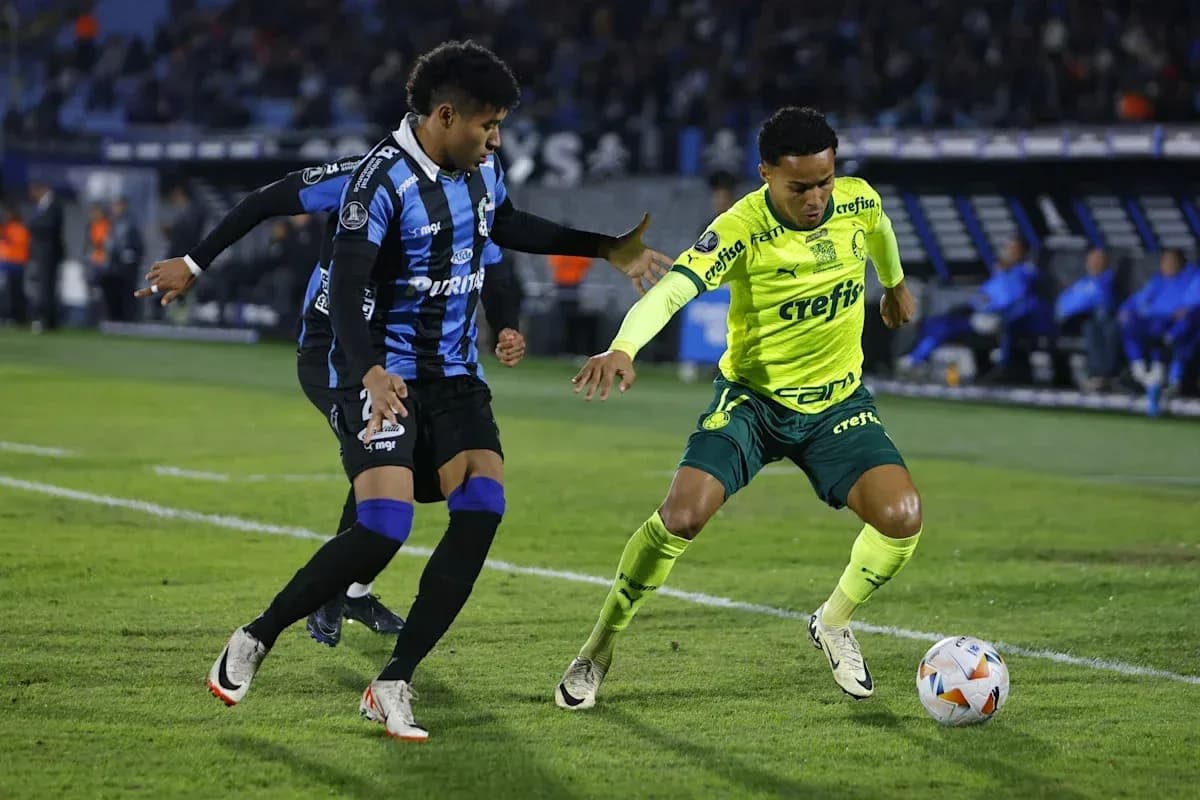 Two players contesting for the ball on field