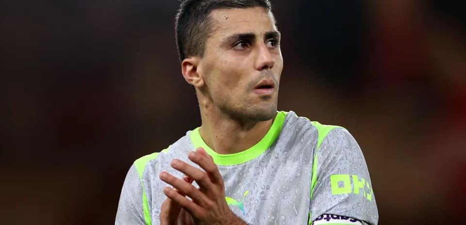 Player applauding on the field in wet jersey