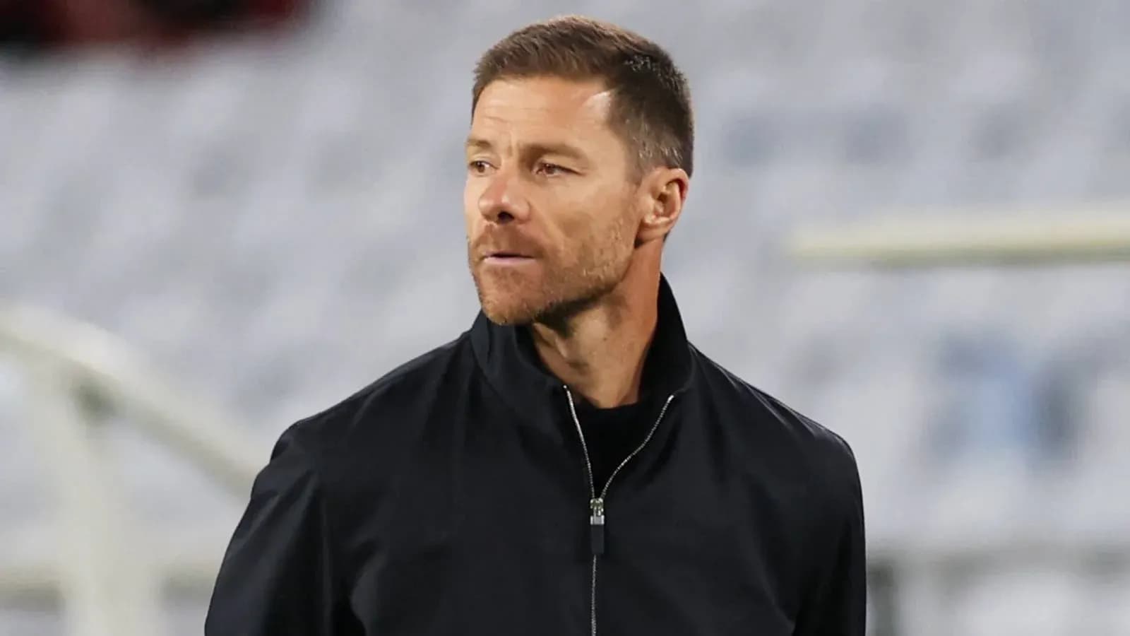 Coach observing during match from sideline