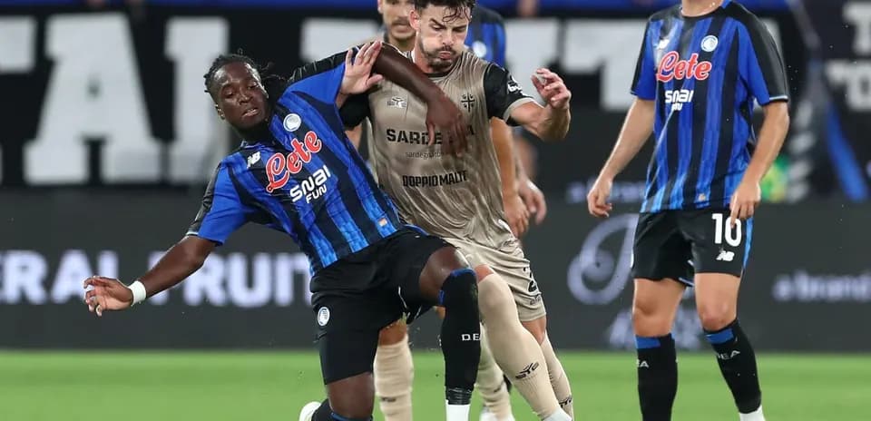 Players competing for the ball during Serie A match
