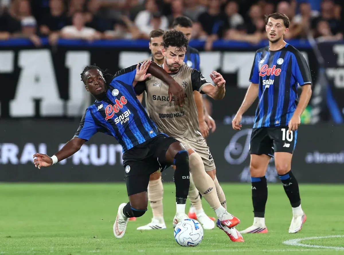 Players competing for the ball during Serie A match