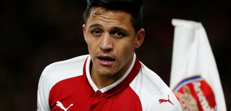 Player in Arsenal kit during match action