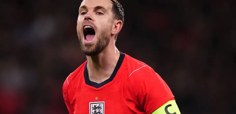 Player celebrating in England's red jersey and captain's armband