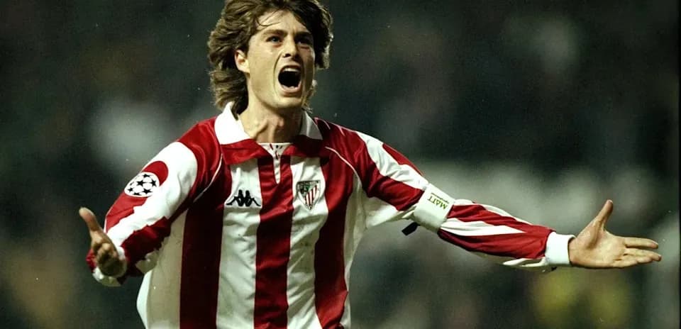 Player celebrating a goal in red and white jersey