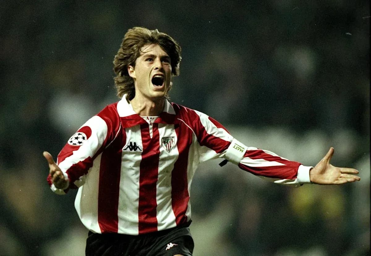 Player celebrating a goal in red and white jersey