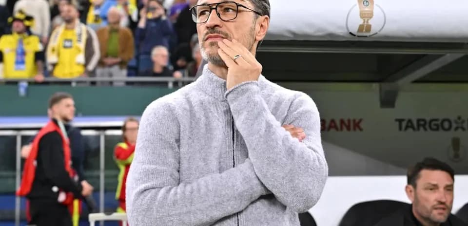 Coach observing match from the sidelines