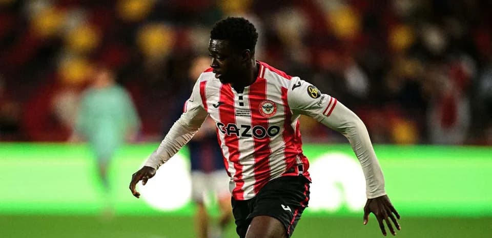 Brentford player sprinting during a match