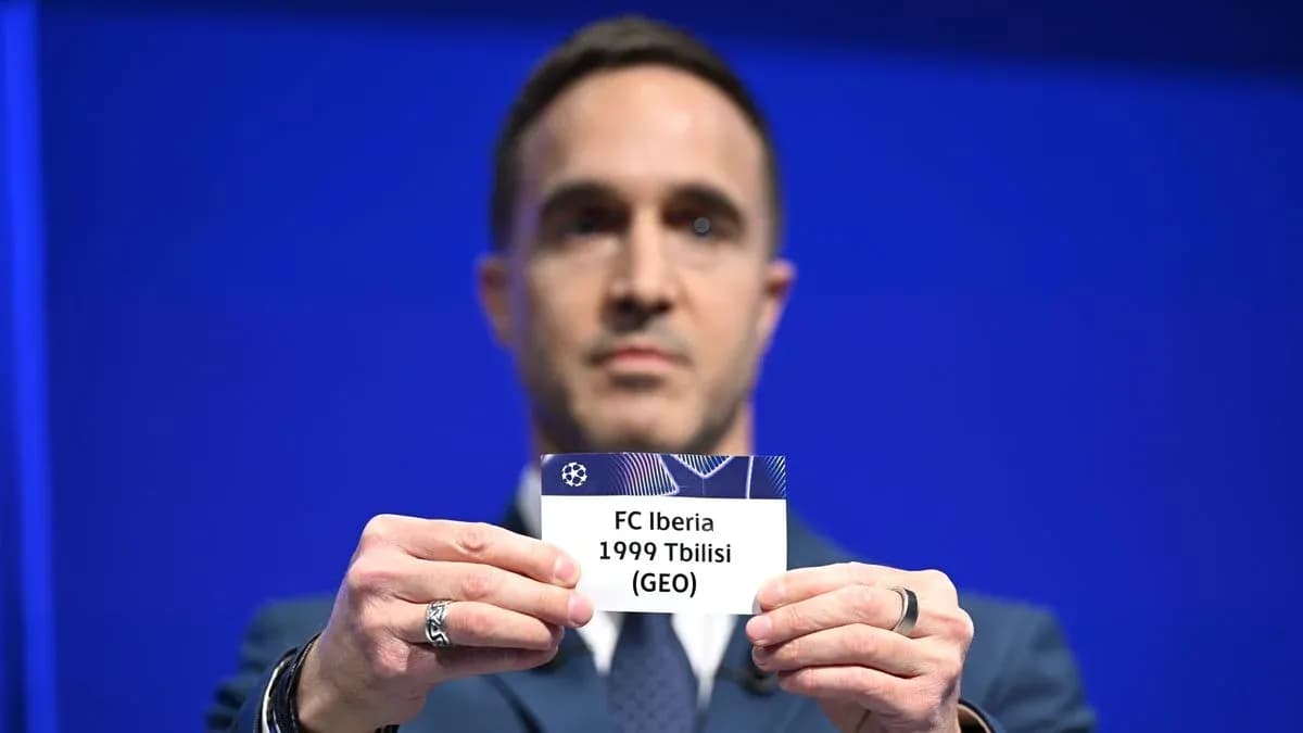 Official holding FC Iberia Tbilisi name card