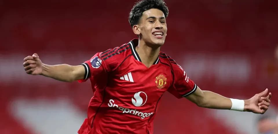 Player celebrating a goal in Manchester United jersey