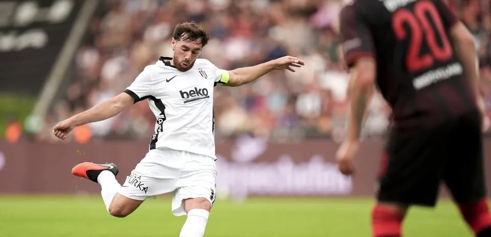 Beşiktaş player kicking the ball during match