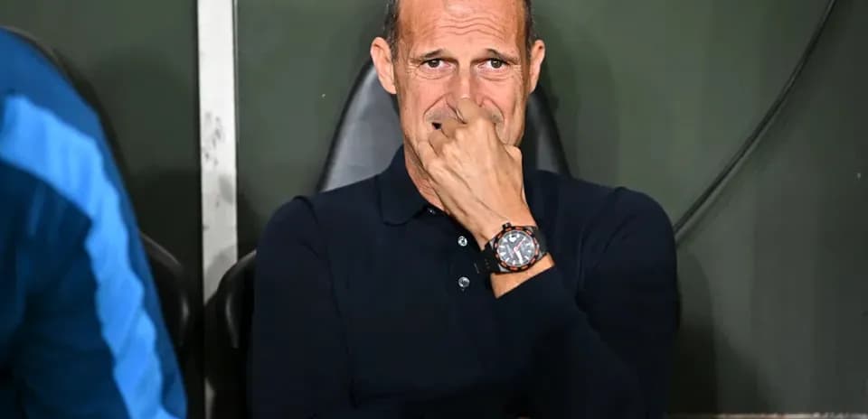 Coach sitting on bench during match observation