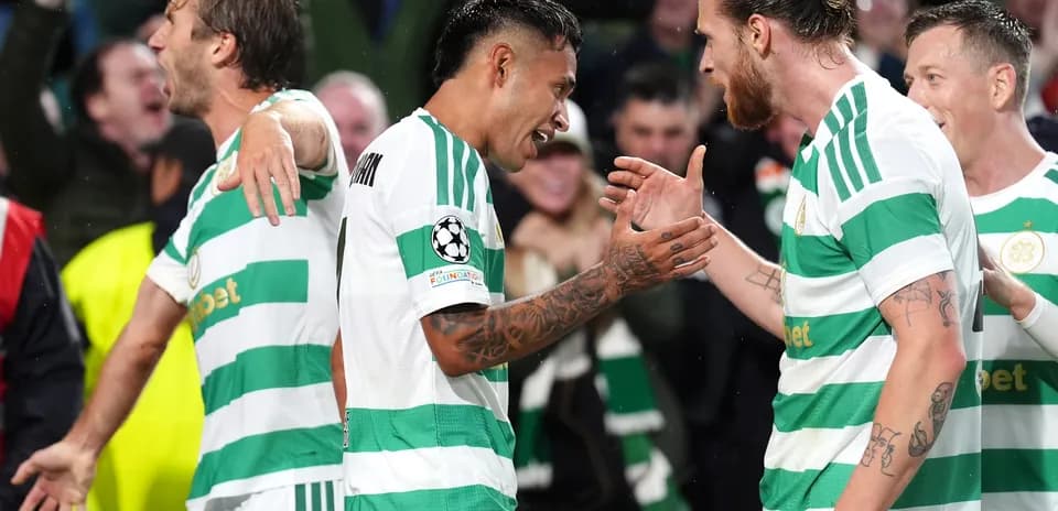 Celtic players celebrating a goal during match