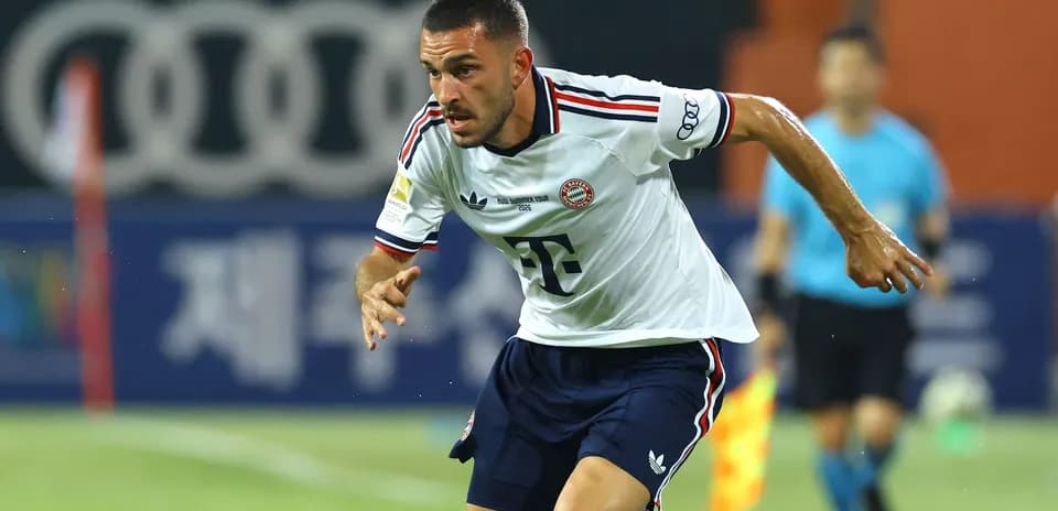 Player running on the field in Bayern Munich kit