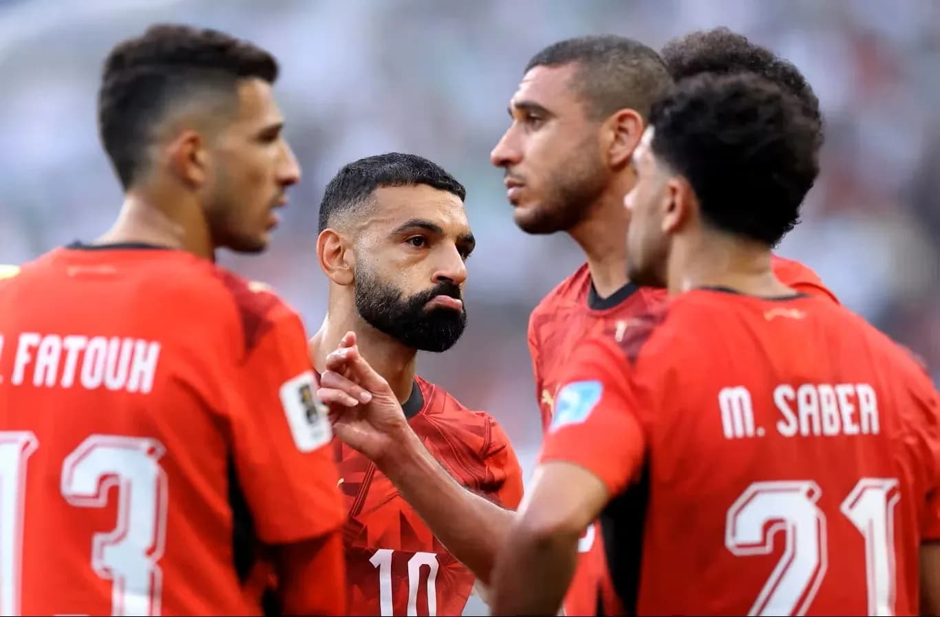 Egyptian players discussing strategy during match