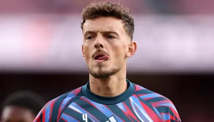Goalkeeper wearing colorful kit during warm-up