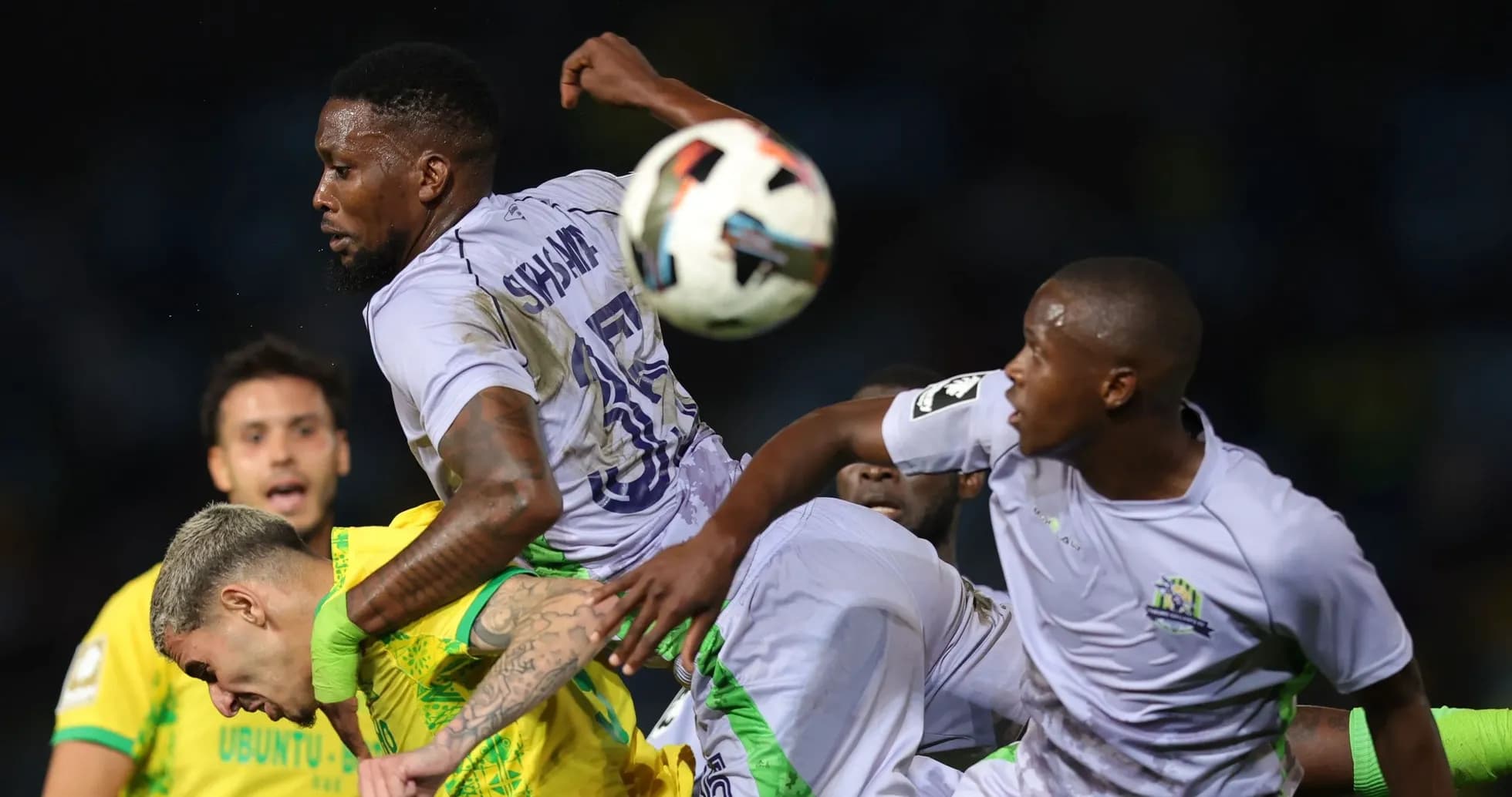 Players contesting for the ball during match action