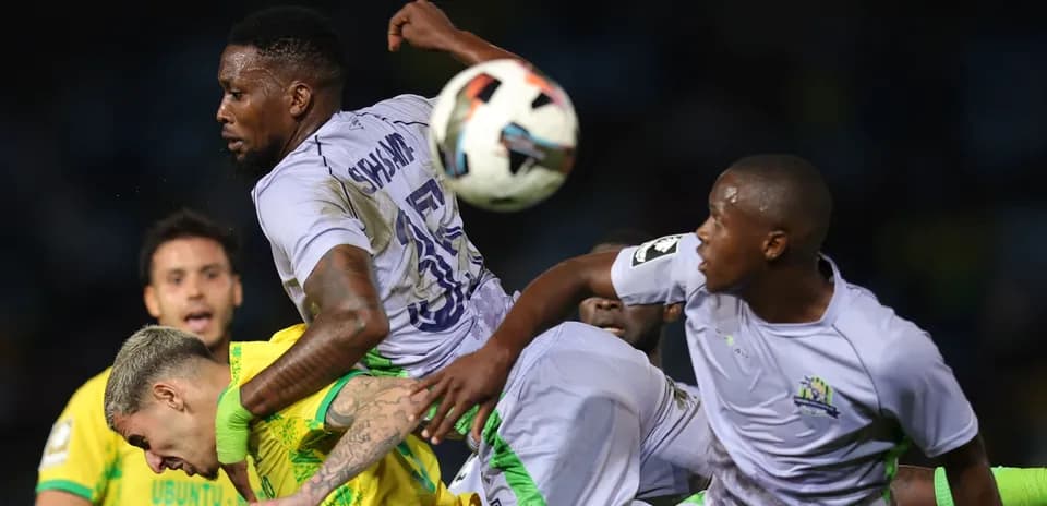 Players contesting for the ball during match action