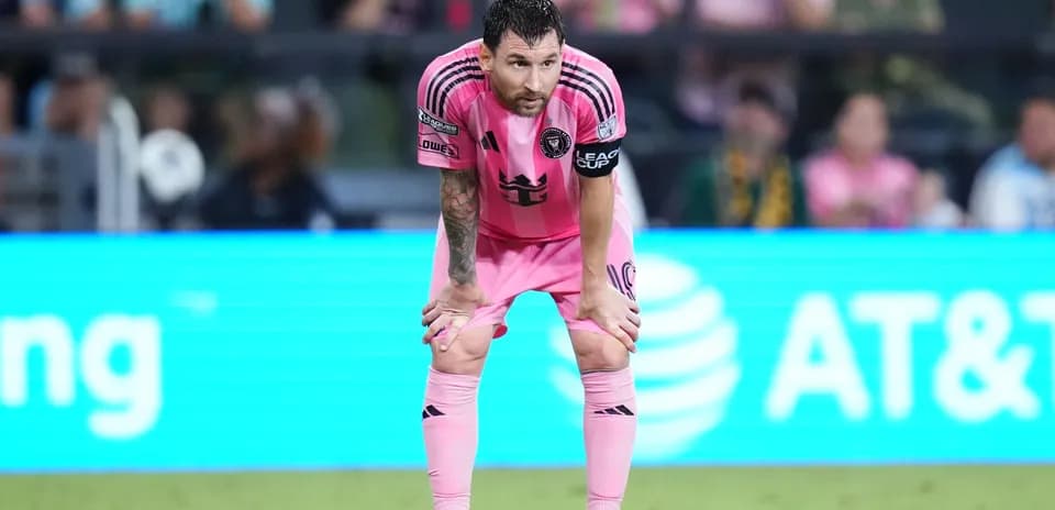 Player in pink uniform resting during match