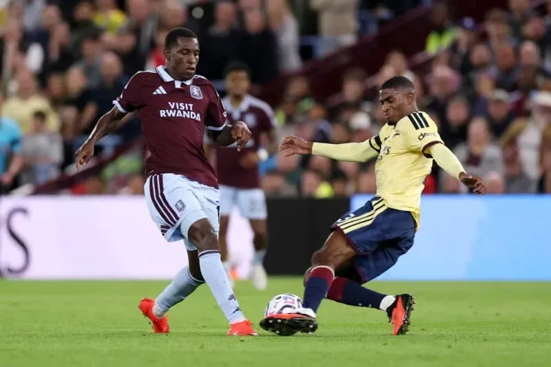 Two players competing for the ball on the field
