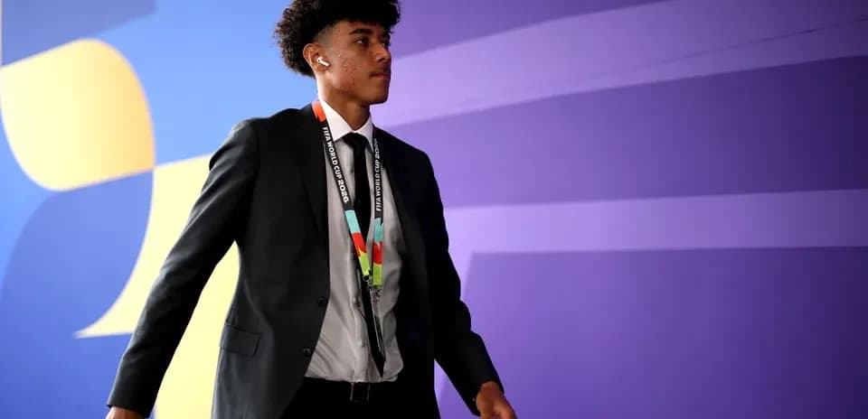 Player walking in formal attire at event venue