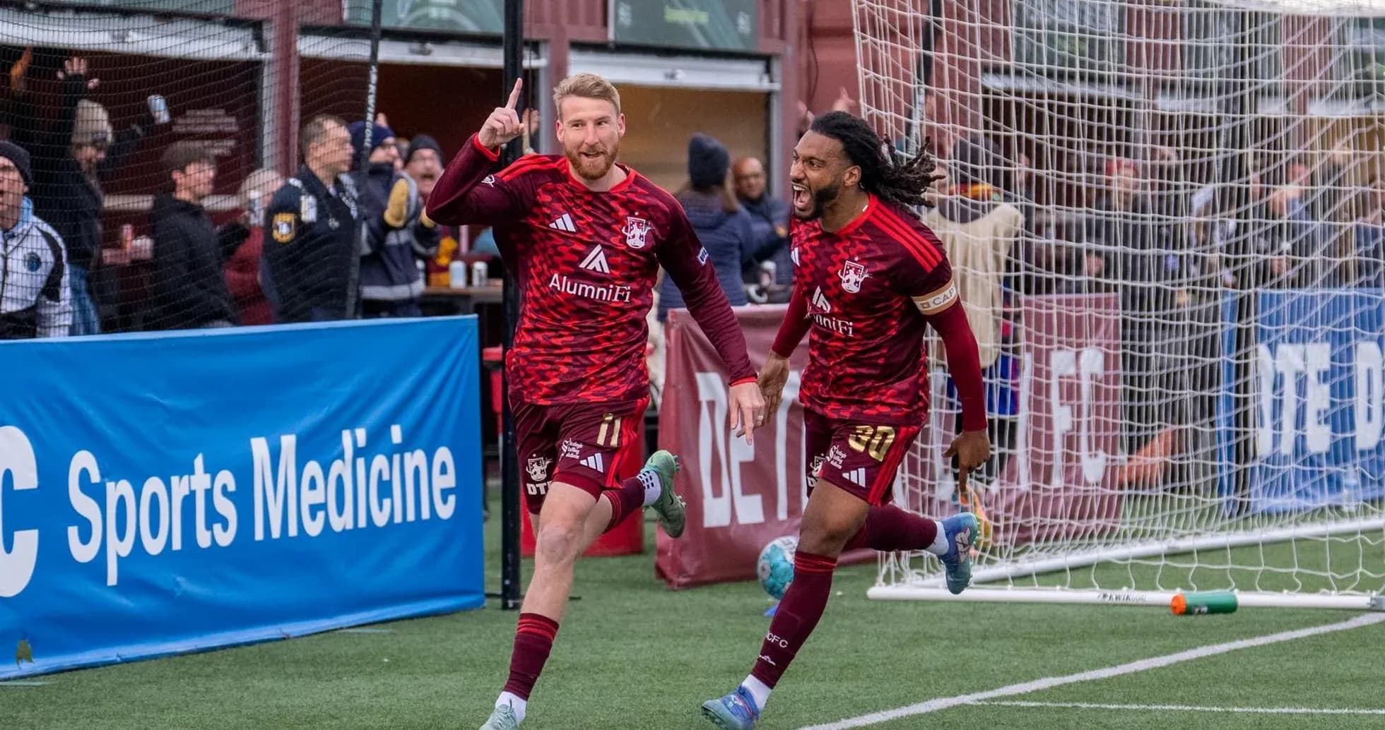 Players celebrating a goal during USL match