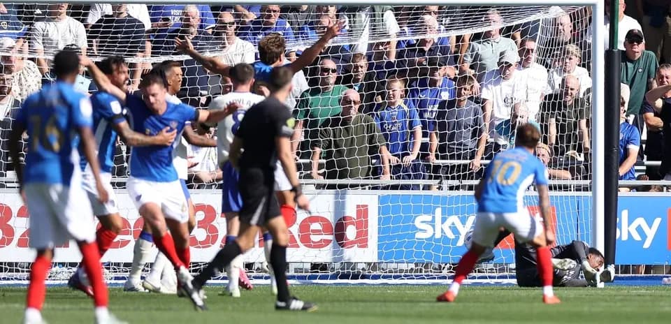 Players reacting after a near goal in match