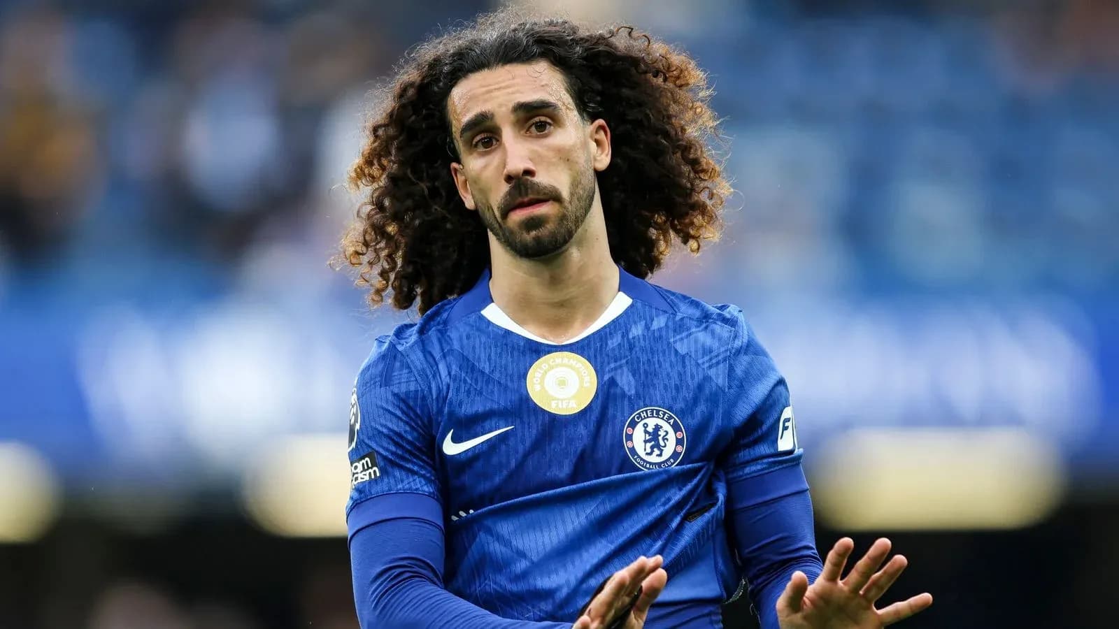 Player in blue Chelsea kit on the pitch