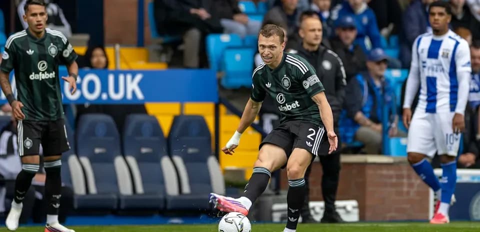 Player kicking ball during match at stadium
